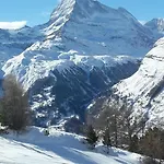 Au Centre De *